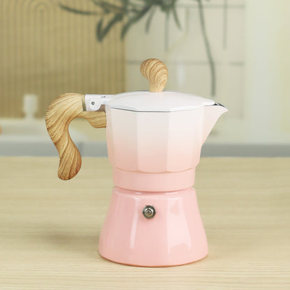 cafetiere expresso italienne rose degrade sur table bois