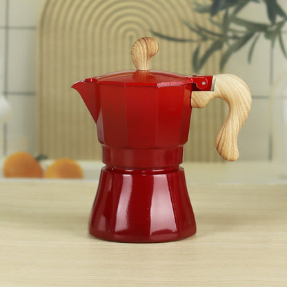 cafetiere expresso italienne rouge degrade sur table bois