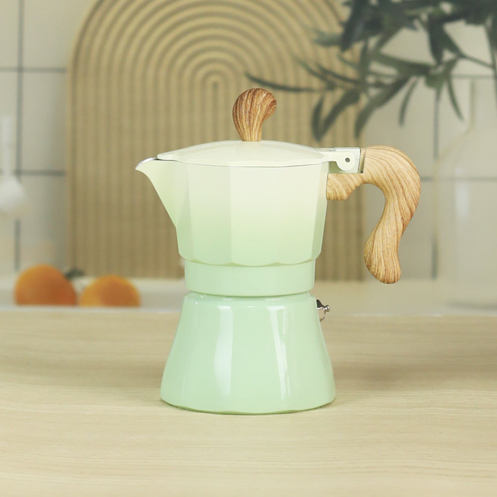 cafetiere expresso italienne verte degrade sur table bois