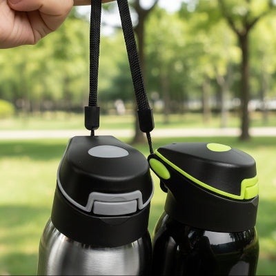 gourde isotherme velo grise noire au parc