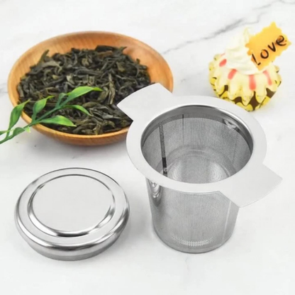infuseur pour théière ouvert sur table the en vrac a cote