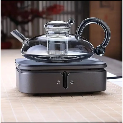 infuseur theiere grise sur plaque chauffante