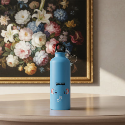 isotherme bouteille bleu elephant sur table bois tableau fleur a cote