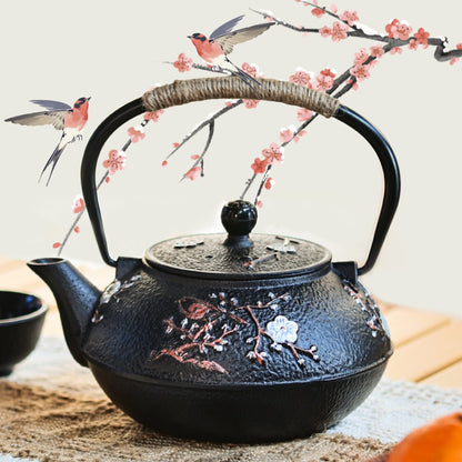 theiere japonaise sur table avec petite branche design et deux petits oiseaux